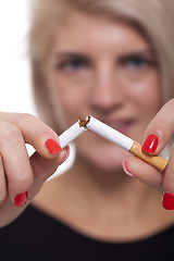 Image showing Close up Young Woman Breaking a Cigarette Stick