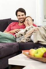 Image showing Couple Resting on the Sofa at the Living Room