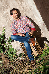 Image showing Male model sitting with legs crossed