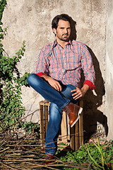 Image showing Male model sitting with legs crossed