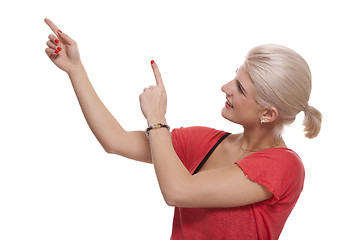 Image showing Happy Blond Woman Pointing Up with Both Hands