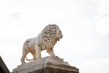 Image showing Bird perched on an ancient stone statue