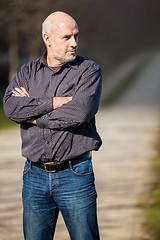 Image showing Confident attractive man standing waiting