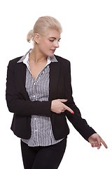 Image showing Businesswoman Pointing Up While Looking at Camera