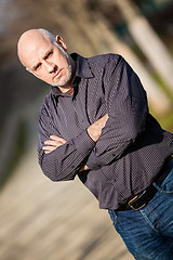 Image showing Confident attractive man standing waiting