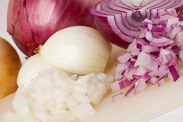 Image showing Whole, peeled and diced brown onion