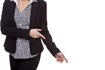 Image showing Businesswoman Pointing Up While Looking at Camera