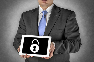 Image showing Businessman with tablet computer and padlock