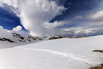 Image showing Snowy mountains and sky with clouds