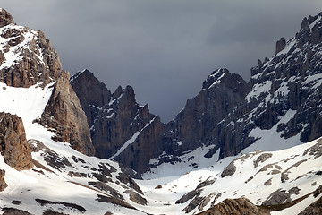 Image showing Snowy mountains and storm clouds