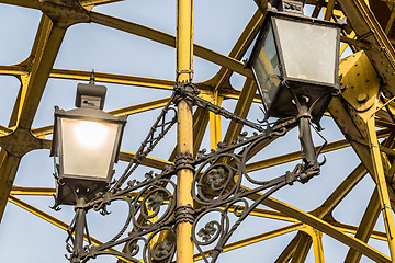 Image showing Decorative lamps hanging from bridge