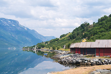 Image showing Red boat-houses at th shore of fjord