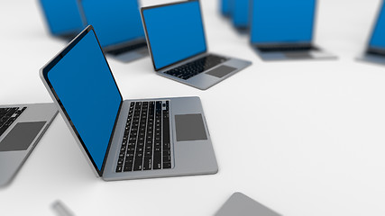 Image showing 3d render of a lot of laptops in a row. 