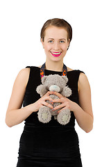 Image showing attractive smiling brunette holding teddy bear