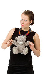 Image showing attractive smiling brunette holding teddy bear