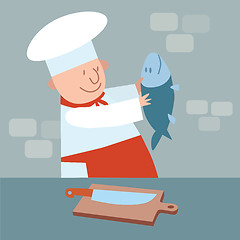 Image showing Cook cut up fresh fish. chef in kitchen