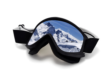 Image showing Ski goggles with reflection of winter mountains