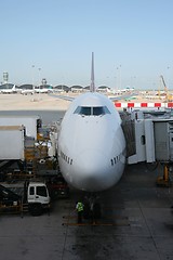 Image showing Boeing 747-700 being loaded.