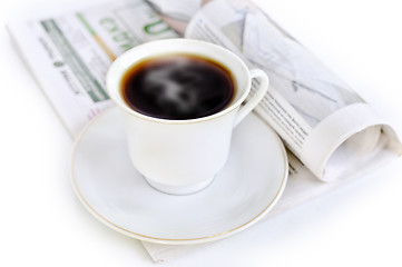 Image showing A cup of hot coffee and newspaper 