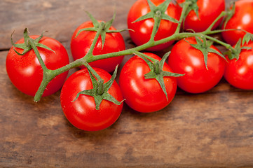 Image showing fresh cherry tomatoes on a cluster