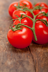 Image showing fresh cherry tomatoes on a cluster