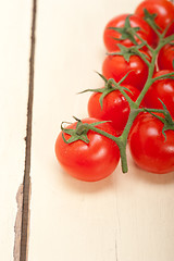 Image showing fresh cherry tomatoes on a cluster