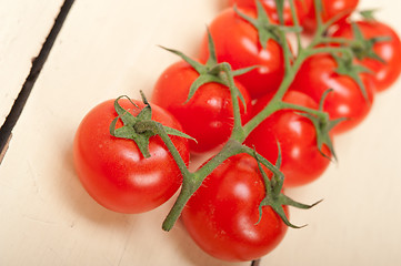 Image showing fresh cherry tomatoes on a cluster