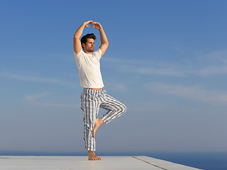 Image showing young man practicing yoga