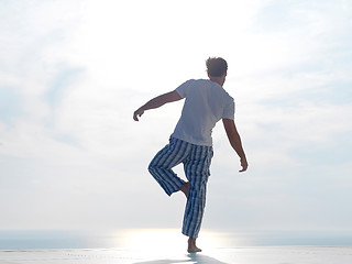 Image showing young man practicing yoga