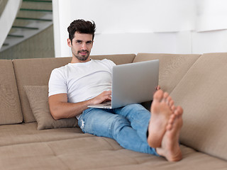 Image showing Man Relaxing On Sofa With Laptop