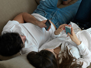 Image showing young couple making selfie together at home