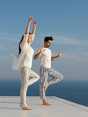 Image showing young couple practicing yoga