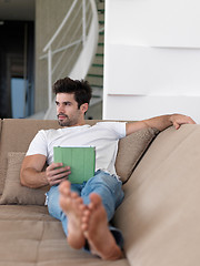 Image showing man using tablet computer from home