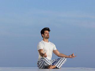 Image showing young man practicing yoga