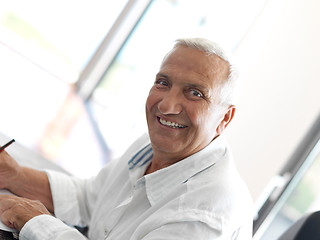 Image showing Portrait of senior man relaxing in sofa