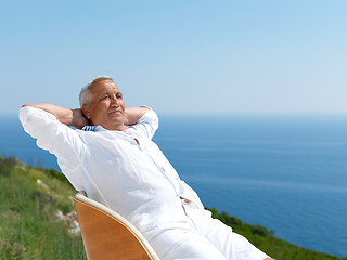 Image showing senior man sitting outside