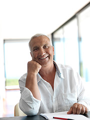 Image showing Portrait of senior man relaxing in sofa