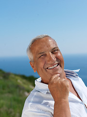 Image showing senior man sitting outside