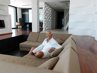 Image showing Portrait of senior man relaxing in sofa