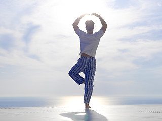 Image showing young man practicing yoga