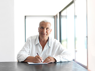 Image showing Portrait of senior man relaxing in sofa