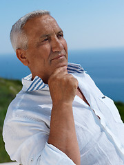 Image showing senior man sitting outside