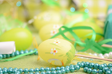 Image showing Easter background with eggs, ribbons and spring decoration