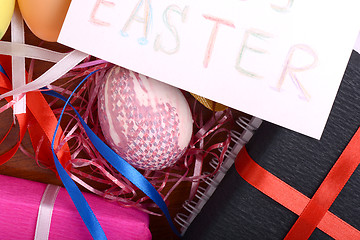 Image showing Easter setting with gift box and spring decoration