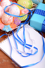 Image showing Easter background with eggs, ribbons and spring decoration