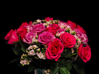 Image showing Bouquet of pink roses at closeup towards black background