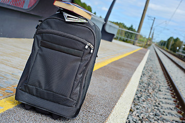 Image showing Gray suitcase on the railway platform