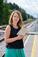 Image showing Female waiting train on the platform 