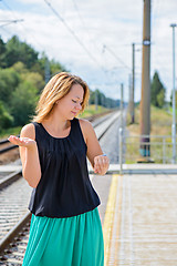 Image showing Female waiting train on the platform 