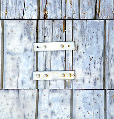 Image showing santo antonino abstract   in a  door curch  closed wood lombardy